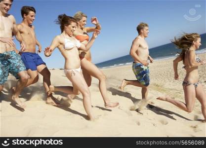 Group Of Teenage Friends Enjoying Beach Holiday Together
