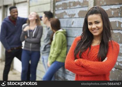 Group Of Teenage Friends Hanging Out In Urban Setting