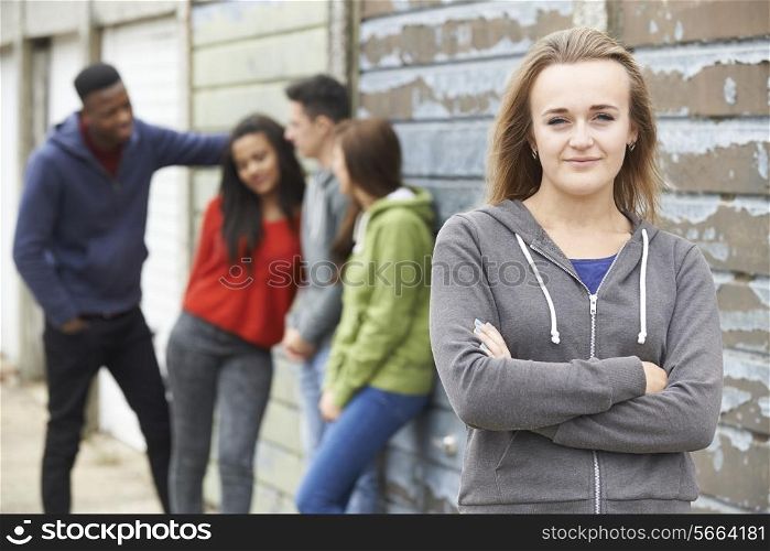 Group Of Teenage Friends Hanging Out In Urban Setting