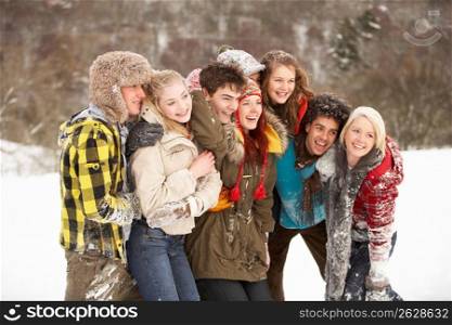 Group Of Teenage Friends Having Fun In Snowy Landscape