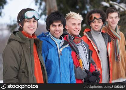 Group Of Teenage Friends In Snowy Winter Landscape