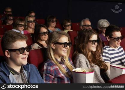 Group Of Teenage Friends Watching 3D Film In Cinema