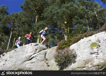 Group Of Teenage Girls Hiking In Countryside