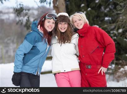 Group Of Teenage Girls In Snowy Landscape