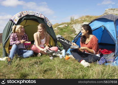 Group Of Teenage Girls On Camping Trip In Countryside