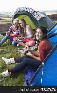 Group Of Teenage Girls On Camping Trip In Countryside