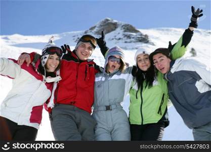 Group of teenage skiers having fun