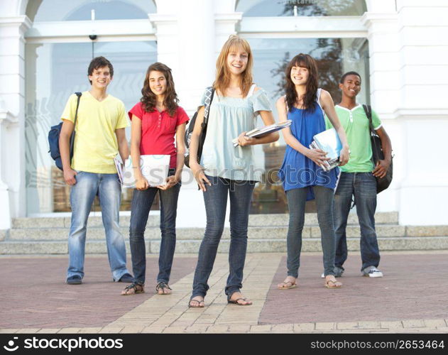 Group Of Teenage Students Standing Outside College Building