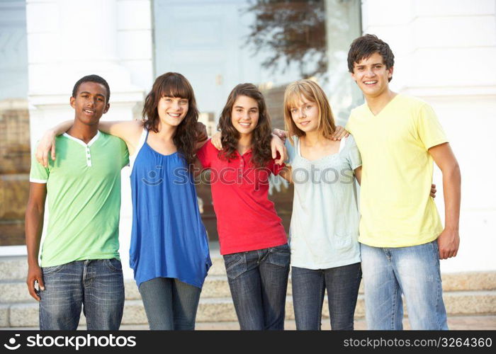 Group Of Teenage Students Standing Outside College Building