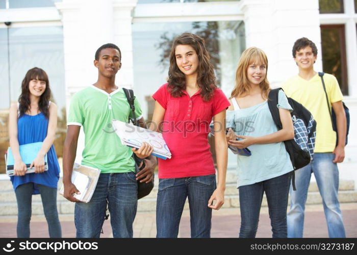 Group Of Teenage Students Standing Outside College Building