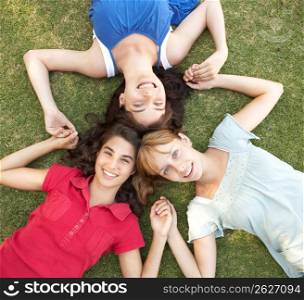 Group Of Teenager Girls Looking Up Into Camera