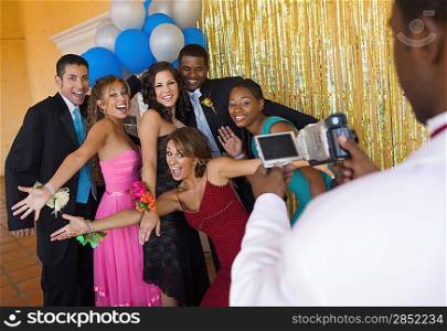 Group of Teenagers Hamming It Up for Prom Photo