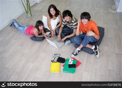 Group of teenagers hanging out at home