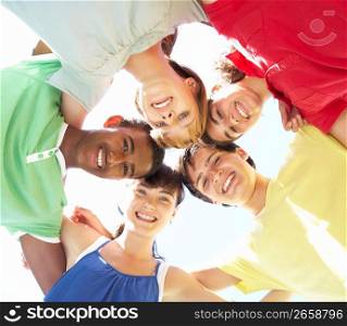 Group Of Teenagers Looking Down Into Camera