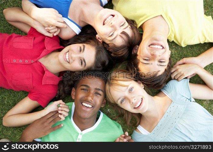 Group Of Teenagers Looking Up Into Camera