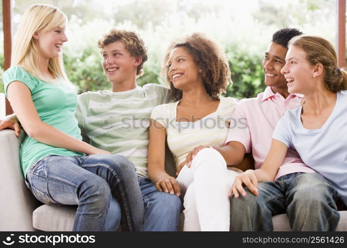 Group Of Teenagers Sitting On A Couch