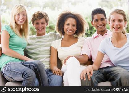 Group Of Teenagers Sitting On A Couch