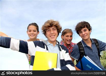 Group of teenagers studying outside the class