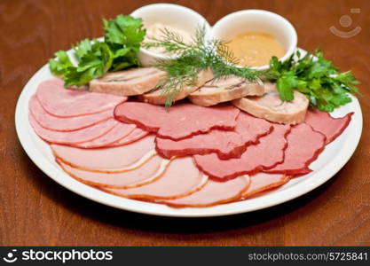 Group of thin sliced meat, ham and sauce