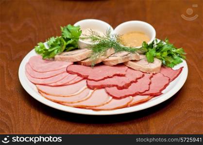 Group of thin sliced meat, ham and sauce
