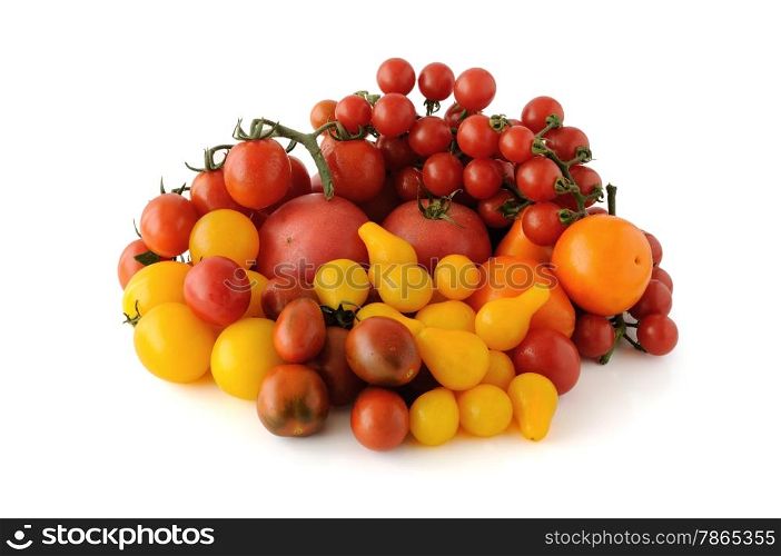 Group of tomatoes of different colors and varieties on a white background