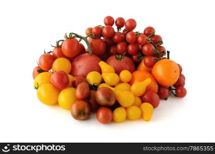 Group of tomatoes of different colors and varieties on a white background