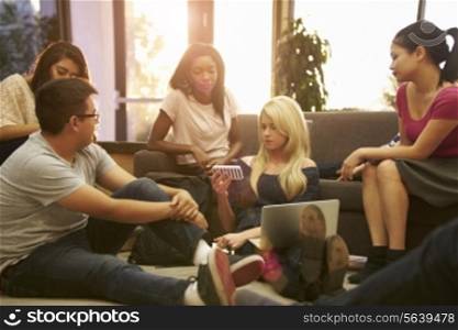 Group Of University Students Relaxing In Common Room