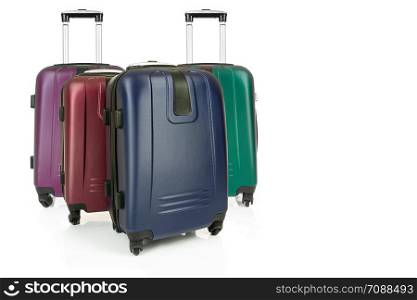 Group of various travel suitcases isolated on a white background