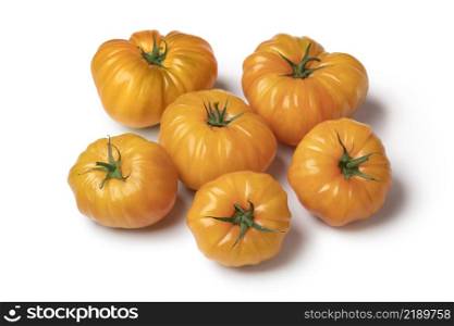 Group of whole yellow coeur de boeuf tomatoes isolated on white background