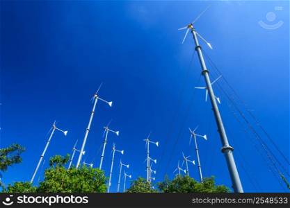 Group Of Wind Turbines With Blue Sky