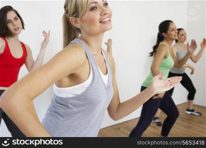 Group Of Women Exercising In Dance Studio