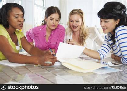 Group Of Women Meeting In Creative Office