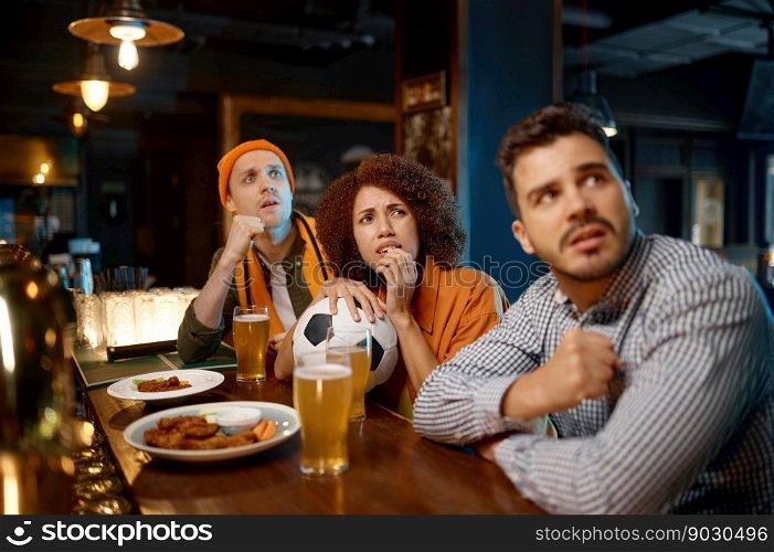 Group of worried friends looking concentrated while watching favorite team ch&ionship at sports bar. Group of worried friends watching favorite team at sports bar