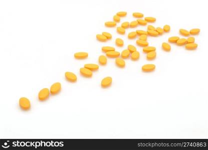 group of yellow vitamins. medicine pills
