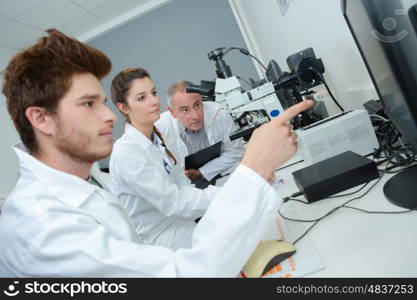 group of young apprentices at a lab