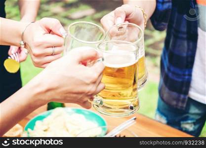 Group of young asian people celebrating beer festivals happy while enjoying home party