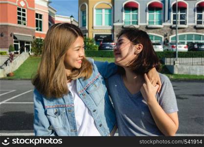 Group of young Asian women walking in an outdoor market in urban city, cheerful beautiful female feeling happy travel together. Lifestyle women travel holiday together concept.