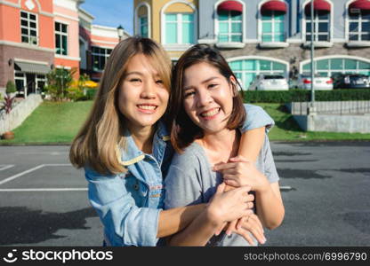 Group of young Asian women walking in an outdoor market in urban city, cheerful beautiful female feeling happy travel together. Lifestyle women travel holiday together concept.