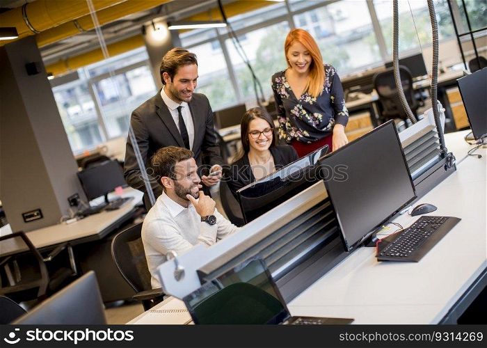 Group of young business people are working together with desktop computer in the office
