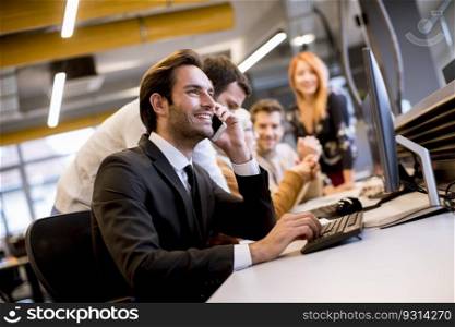 Group of young business people are working together with laptop