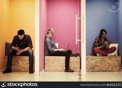 group of young business people having fun, relaxing and working in creative room space at modern startup office