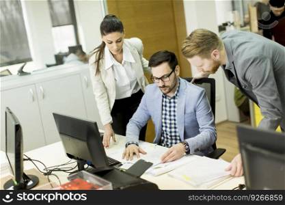 Group of young business people in a meeting at office