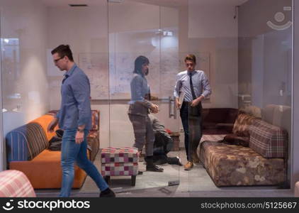 group of young casual software developer sleeping on sofa during a work break in creative startup office