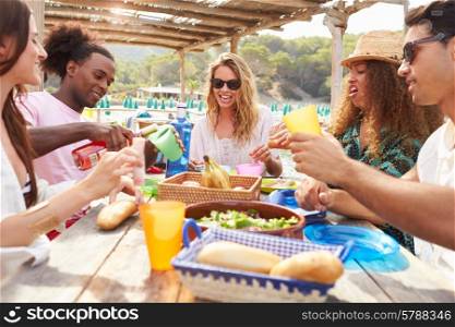 Group Of Young Friends Enjoying Lunch Outdoors