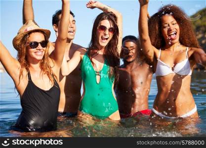 Group Of Young Friends Having Fun In Sea Together