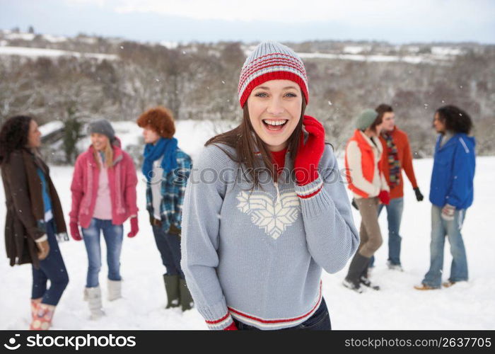 Group Of Young Friends Having Fun In Snowy Landscape