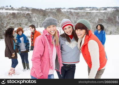 Group Of Young Friends Having Fun In Snowy Landscape