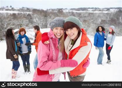 Group Of Young Friends Having Fun In Snowy Landscape