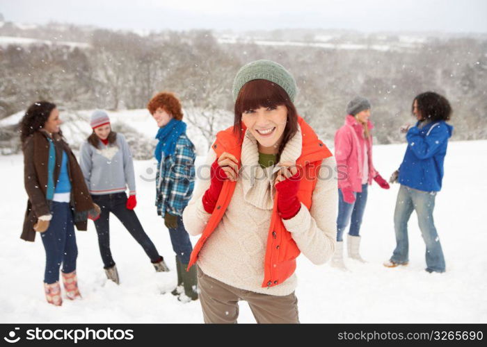 Group Of Young Friends Having Fun In Snowy Landscape