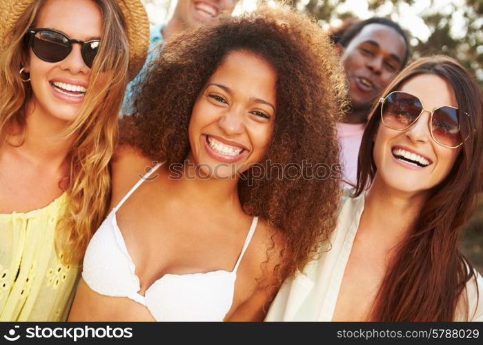 Group Of Young Friends Having Party On Beach Together